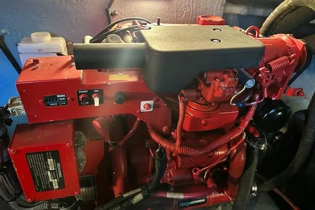 Slide: The Image of Red engine of a 2001 Sea Ray 380 Sundancer boat, detailed view. - 33