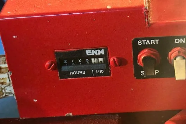 Slide: The Image of Hour meter and control switches on a 2001 Sea Ray 380 Sundancer boat. - 34