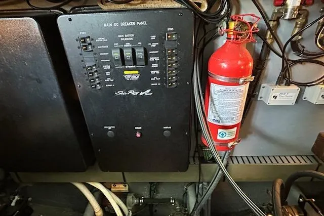 Slide: The Image of Main DC breaker panel and fire extinguisher in 2001 Sea Ray 380 Sundancer boat. - 35