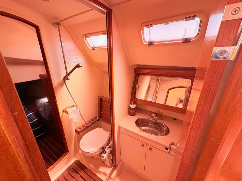 Slide: The Image of Interior view of a 2006 Hunter 38 yacht bathroom. - 13