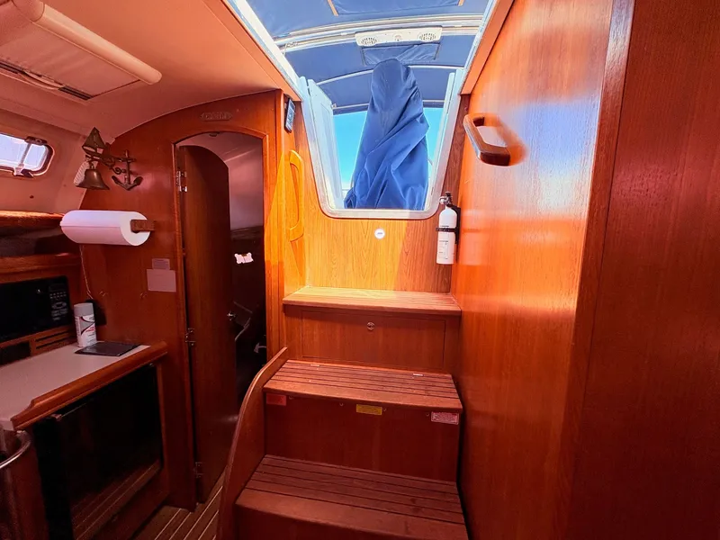Slide: The Image of Interior of a 2006 Hunter 38 yacht with wooden finish. - 14
