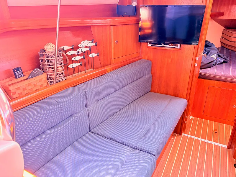 Slide: The Image of Interior of a 2006 Hunter 38 yacht with sofa and TV. - 18