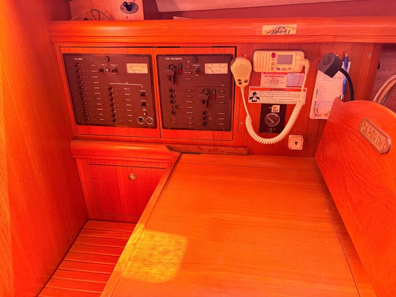 Slide: The Image of Interior view of a 2006 Hunter 38 sailboat with control panel. - 19
