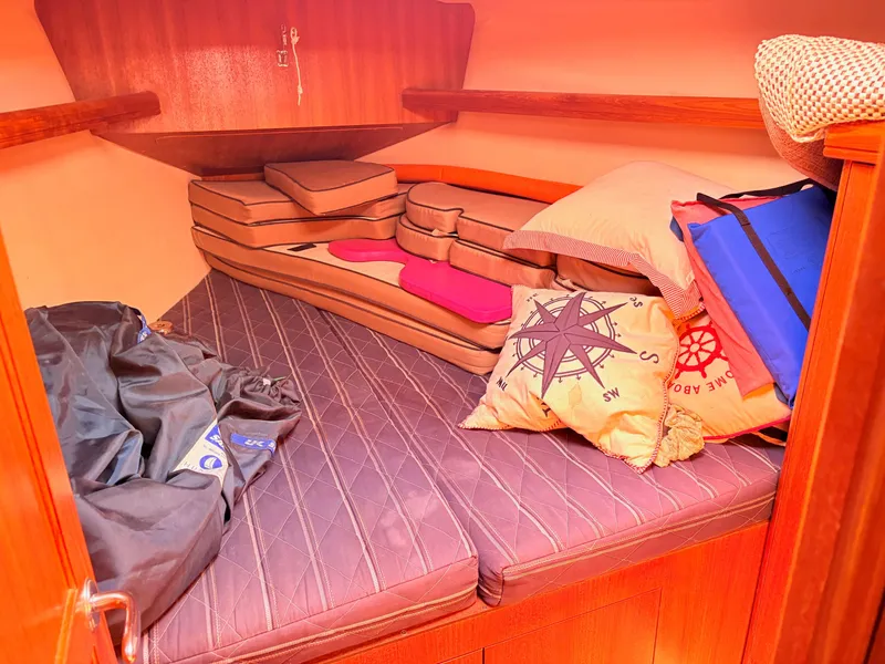 Slide: The Image of Interior of a 2006 Hunter 38 yacht, cozy sleeping cabin. - 21