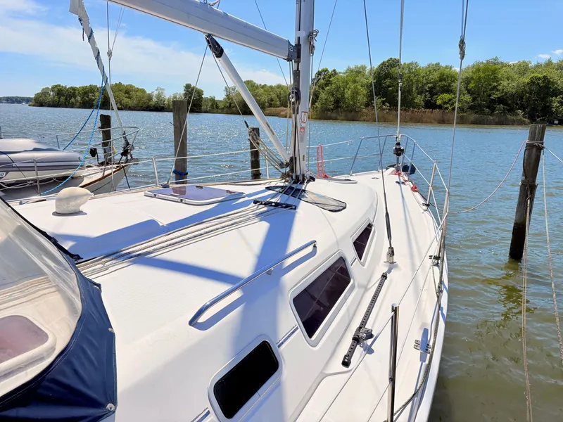 Slide: The Image of 2006 Hunter 38 sailboat docked on a sunny day. - 3