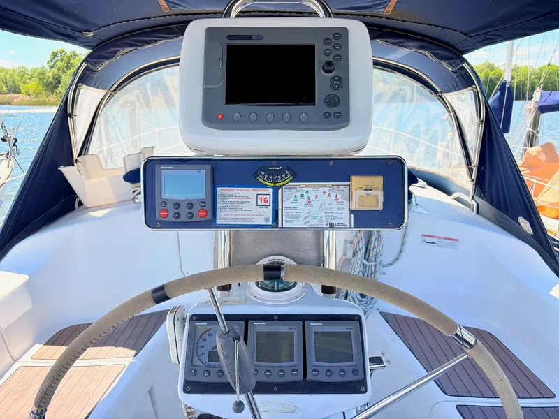 Slide: The Image of Cockpit of a 2006 Hunter 38 yacht with navigation instruments. - 4