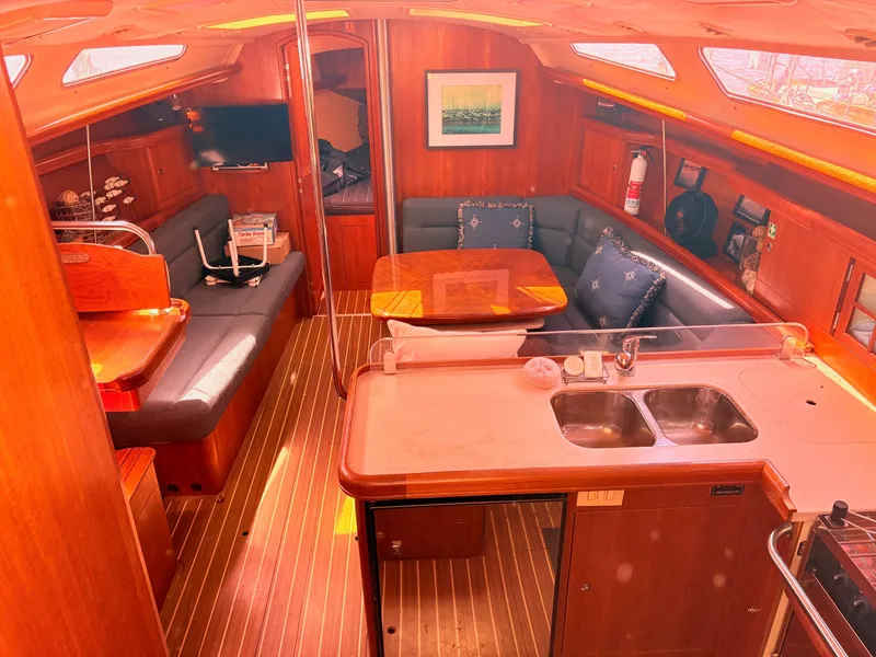 Slide: The Image of Interior of a 2006 Hunter 38 yacht with cozy living area. - 8