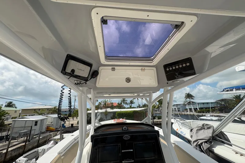 Slide: The Image of Interior view of 2017 Sea Fox 288 Commander boat with navigation equipment and skylight. - 18