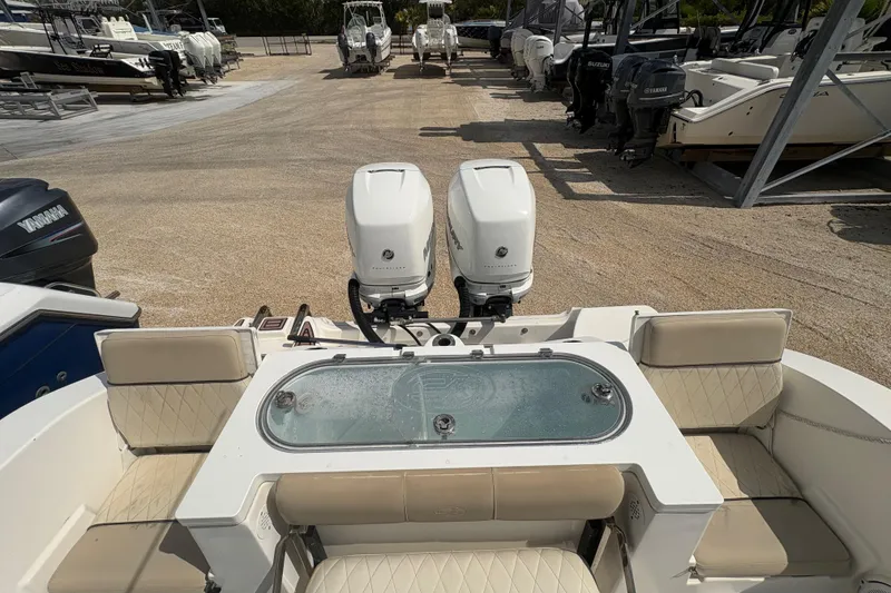 Slide: The Image of 2017 Sea Fox 288 Commander boat with twin outboard engines in a marina. - 21
