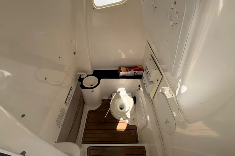 Slide: The Image of Interior of 2017 Sea Fox 288 Commander boat bathroom with wooden flooring and compact design. - 23