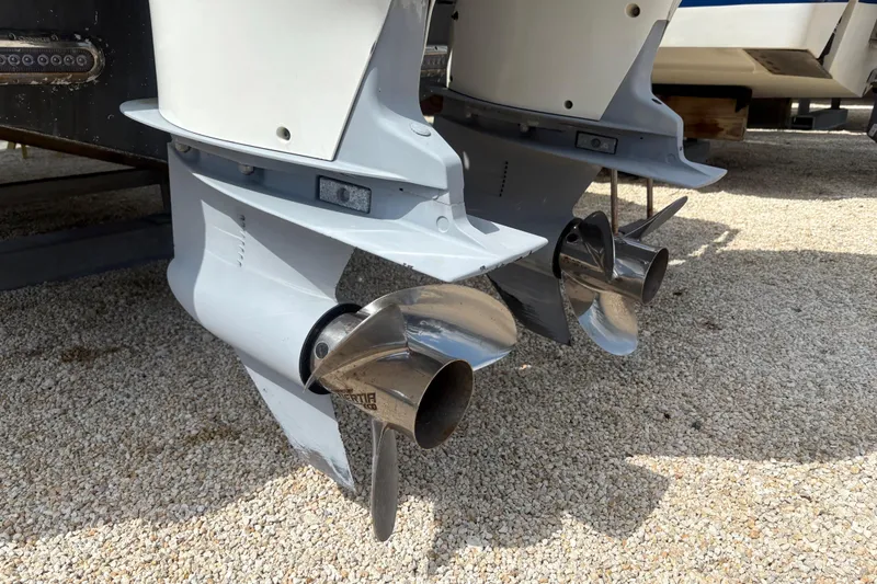 Slide: The Image of Twin propellers of a 2017 Sea Fox 288 Commander boat on gravel surface. - 24
