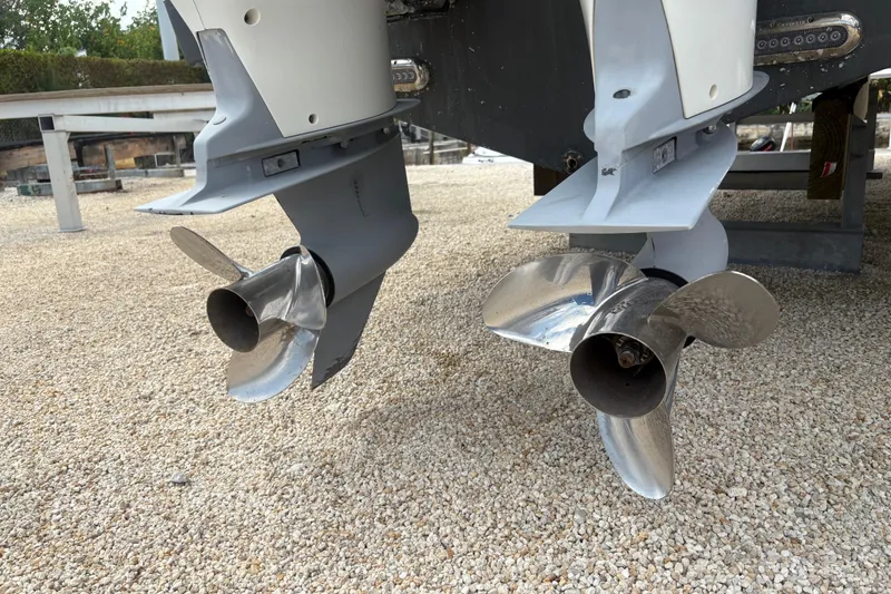 Slide: The Image of Twin propellers of a 2017 Sea Fox 288 Commander boat on gravel surface. - 25