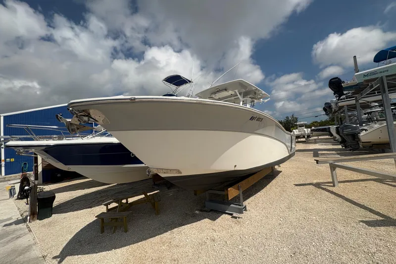 Slide: The Image of 2017 Sea Fox 288 Commander boat on display under a partly cloudy sky. - 3