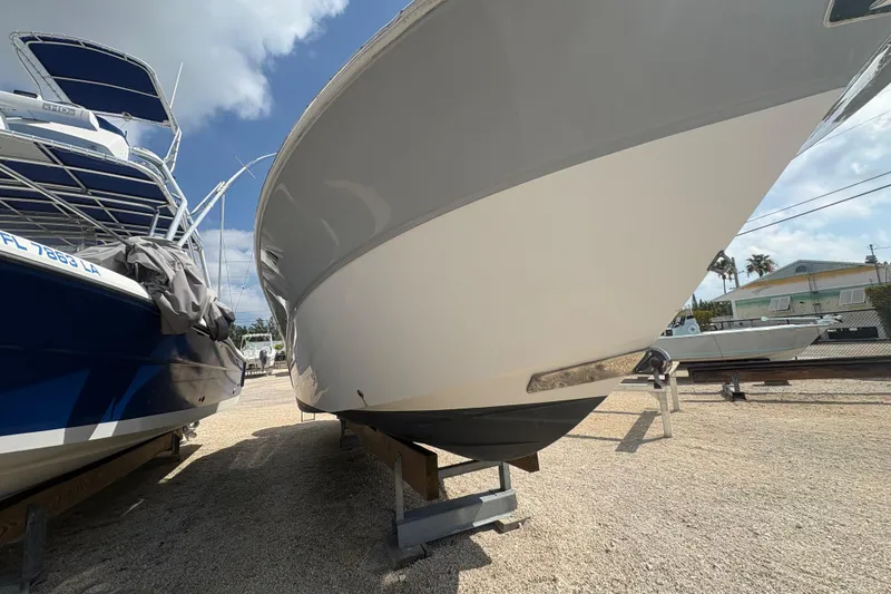 Slide: The Image of 2017 Sea Fox 288 Commander boat on dry dock under a clear sky. - 5