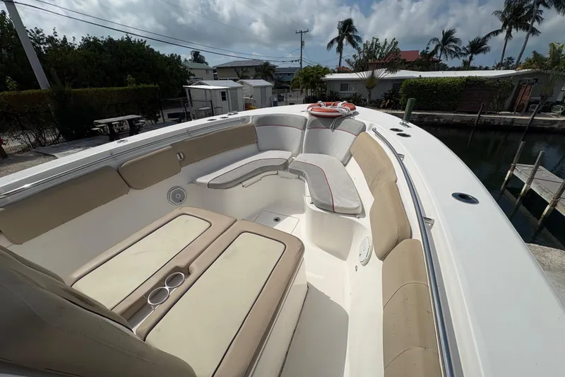 Slide: The Image of 2017 Sea Fox 288 Commander boat interior with cushioned seating and cup holders. - 9