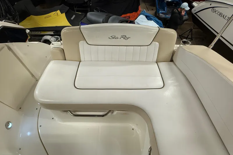 Slide: The Image of 2012 Sea Ray Sundancer 280 boat seating area with white upholstery. - 17