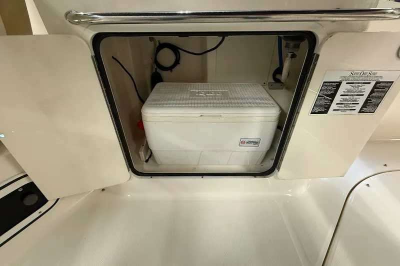 Slide: The Image of Storage compartment with cooler on a 2012 Sea Ray Sundancer 280 boat. - 22