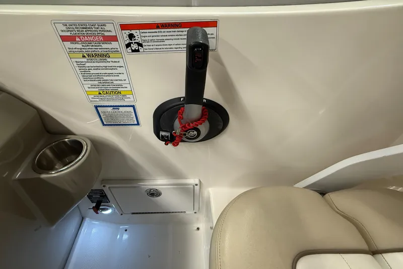 Slide: The Image of Control panel and seating area of 2012 Sea Ray Sundancer 280 boat. - 28