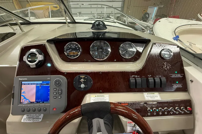 Slide: The Image of 2012 Sea Ray Sundancer 280 dashboard with navigation system and control panel. - 30