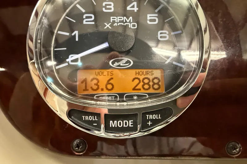 Slide: The Image of Close-up of a 2012 Sea Ray Sundancer 280 gauge showing 13.6 volts and 288 hours. - 34