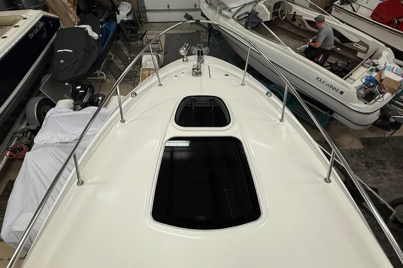 Slide: The Image of 2012 Sea Ray Sundancer 280 boat in storage, viewed from the bow. - 37