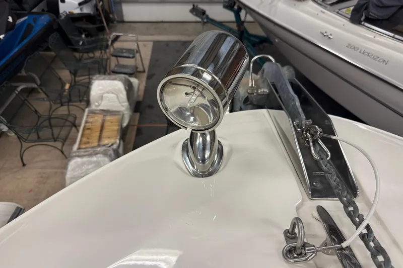 Slide: The Image of Close-up of a 2012 Sea Ray Sundancer 280 spotlight and anchor chain. - 39