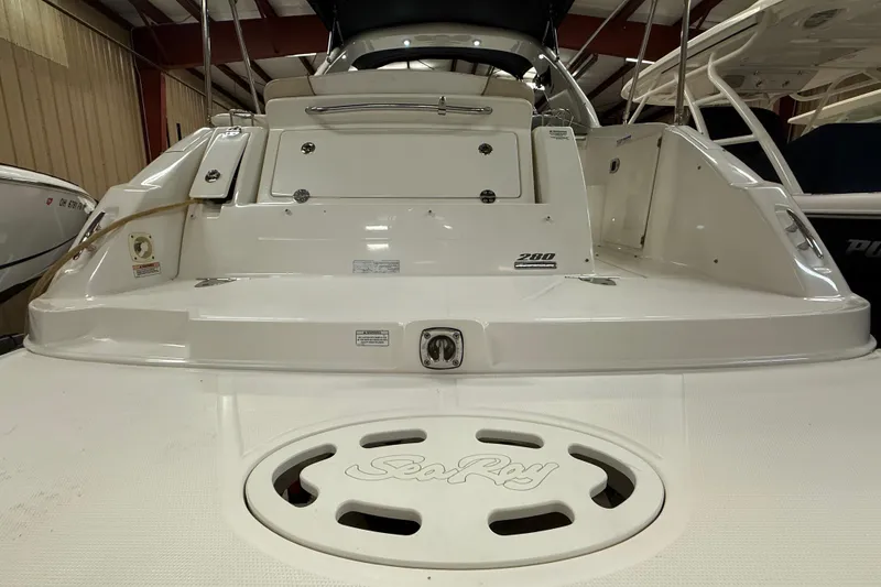 Slide: The Image of 2012 Sea Ray Sundancer 280 boat stern view in indoor storage facility. - 4