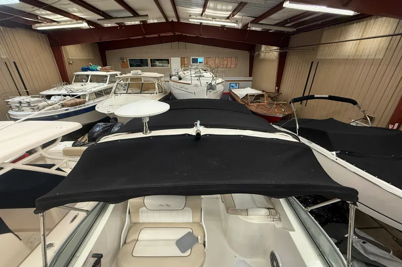 Slide: The Image of Indoor storage of multiple boats, featuring a 2012 Sea Ray Sundancer 280. - 41