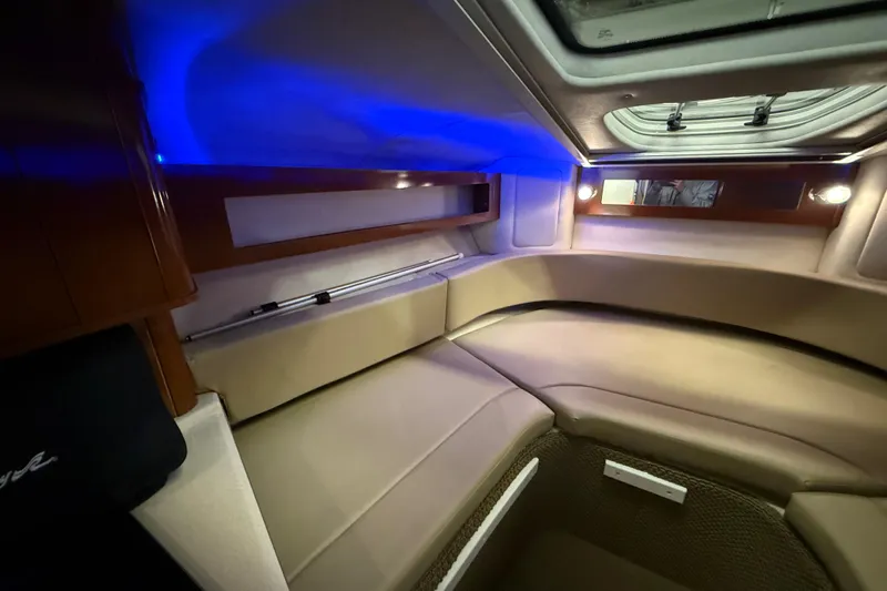Slide: The Image of Interior cabin of 2012 Sea Ray Sundancer 280 with ambient blue lighting. - 50