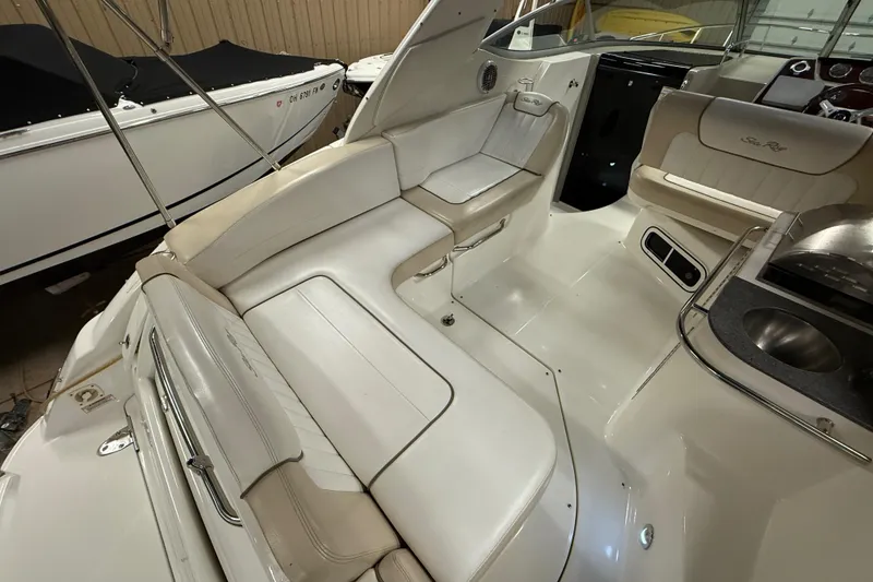 Slide: The Image of Interior view of a 2012 Sea Ray Sundancer 280 boat with white seating. - 6
