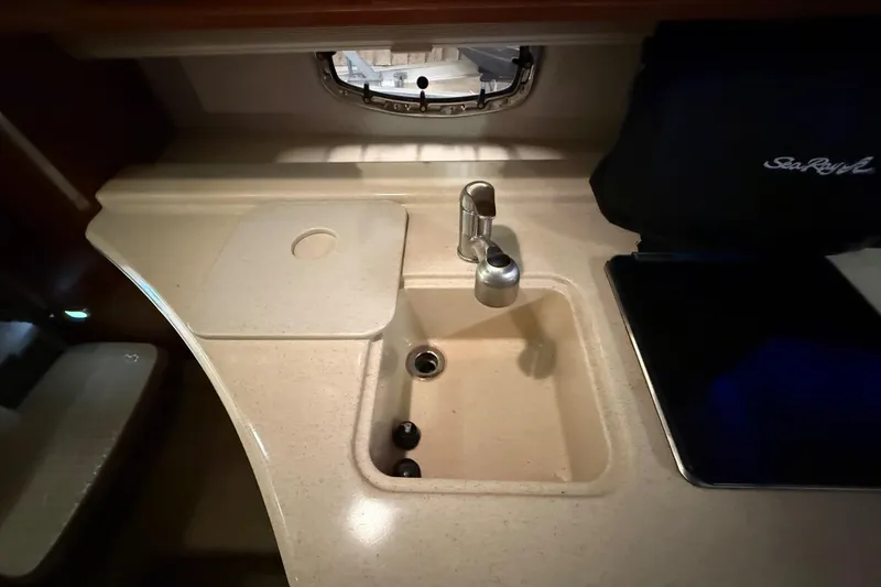 Slide: The Image of Compact kitchen sink area in 2012 Sea Ray Sundancer 280 yacht. - 60