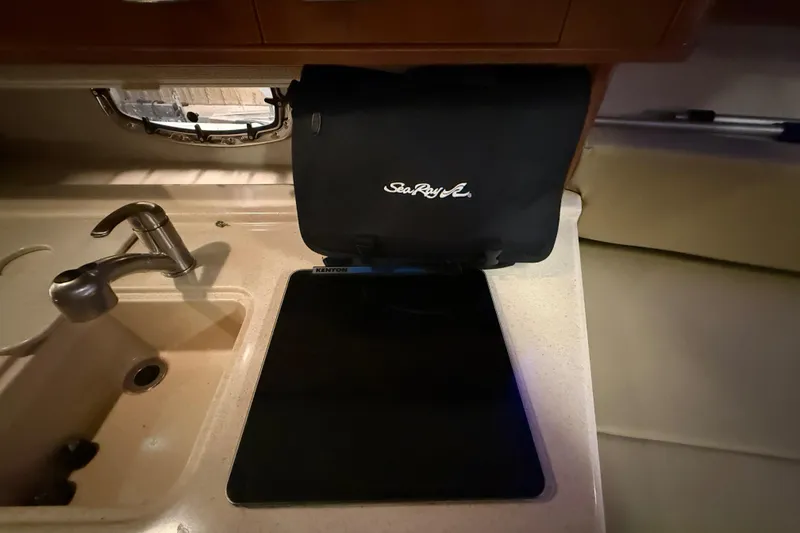 Slide: The Image of Interior of 2012 Sea Ray Sundancer 280 with sink and stove area. - 61