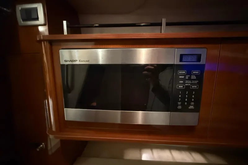Slide: The Image of Sharp Carousel microwave in 2012 Sea Ray Sundancer 280 yacht interior. - 64