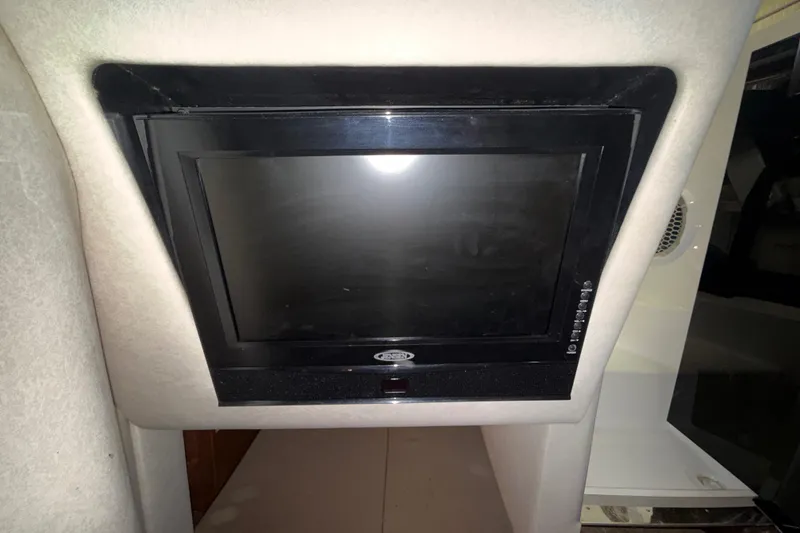 Slide: The Image of Built-in TV screen inside 2012 Sea Ray Sundancer 280 cabin. - 65