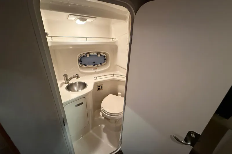 Slide: The Image of Compact bathroom in 2012 Sea Ray Sundancer 280 yacht with sink and toilet. - 66