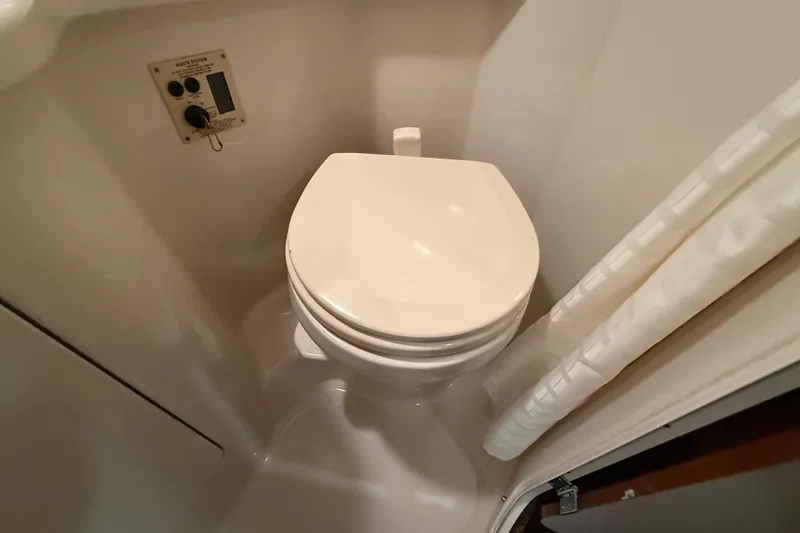 Slide: The Image of Toilet in 2012 Sea Ray Sundancer 280 boat bathroom with control panel. - 69