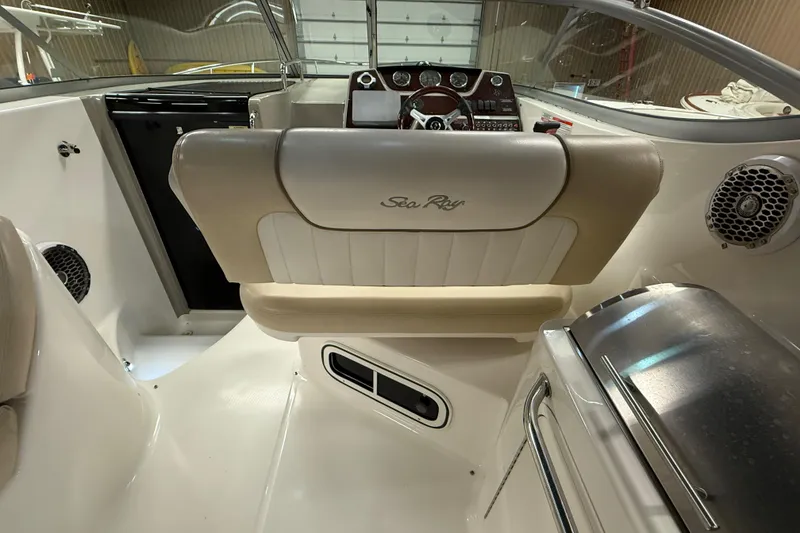 Slide: The Image of Interior of a 2012 Sea Ray Sundancer 280 boat, featuring helm and seating area. - 9
