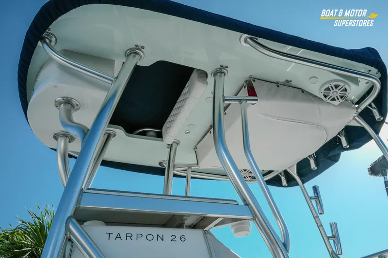 Slide: The Image of 2023 Andros 26 Tarpon boat with T-top and stainless steel frame, viewed from below. - 11
