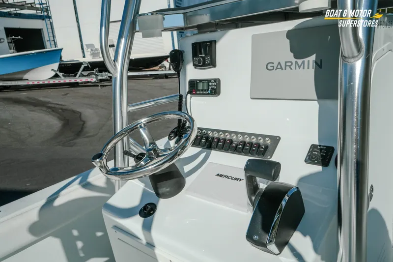 Slide: The Image of 2023 Andros 26 Tarpon boat console with Garmin navigation and Mercury controls. - 12