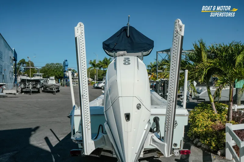 Slide: The Image of 2023 Andros 26 Tarpon boat at dealership, rear view with motor and power poles. - 6