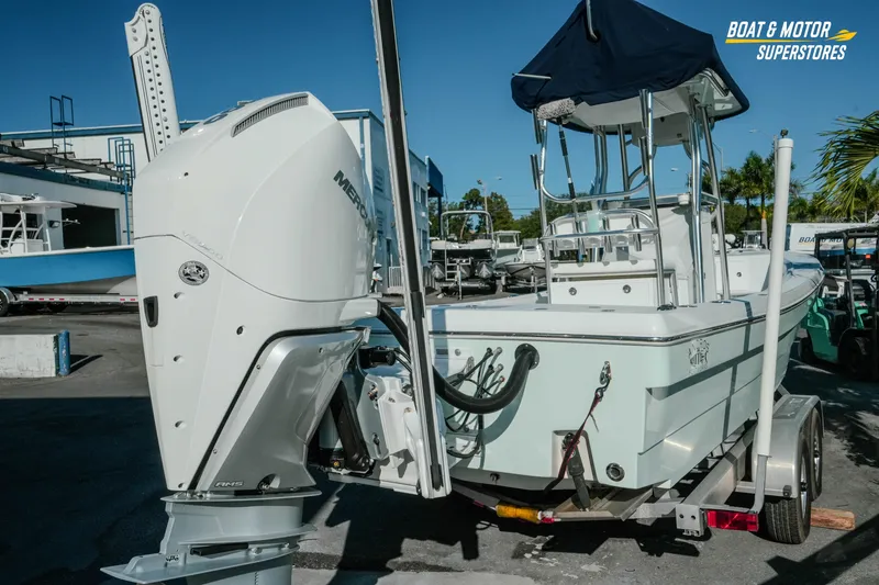 Slide: The Image of 2023 Andros 26 Tarpon boat with Mercury outboard motor on trailer. - 7