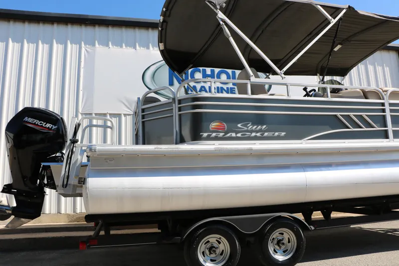 Slide: The Image of 2021 Sun Tracker Party Barge 20 DLX pontoon boat with Mercury engine on trailer. - 12