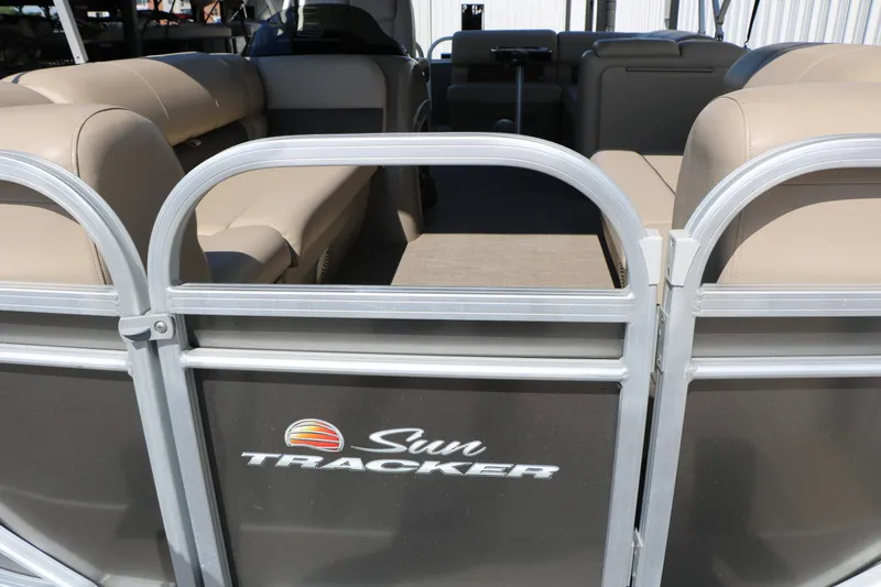 Slide: The Image of 2021 Sun Tracker Party Barge 20 DLX pontoon boat with beige seating and logo. - 15