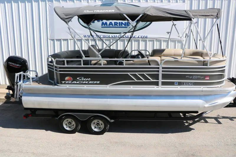 Slide: The Image of 2021 Sun Tracker Party Barge 20 DLX pontoon boat with canopy and trailer. - 9