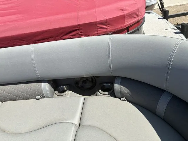 Slide: The Image of Interior of a 2022 Bennington 23LSR SPS boat with gray upholstery. - 11