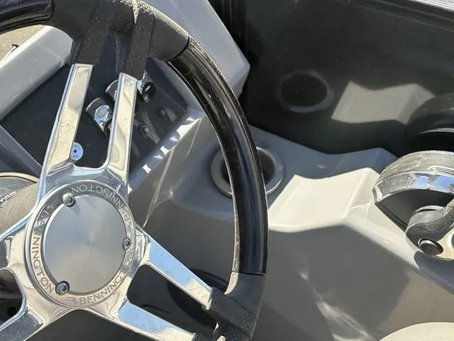 Slide: The Image of Steering wheel of a 2022 Bennington 23LSR SPS boat. - 18