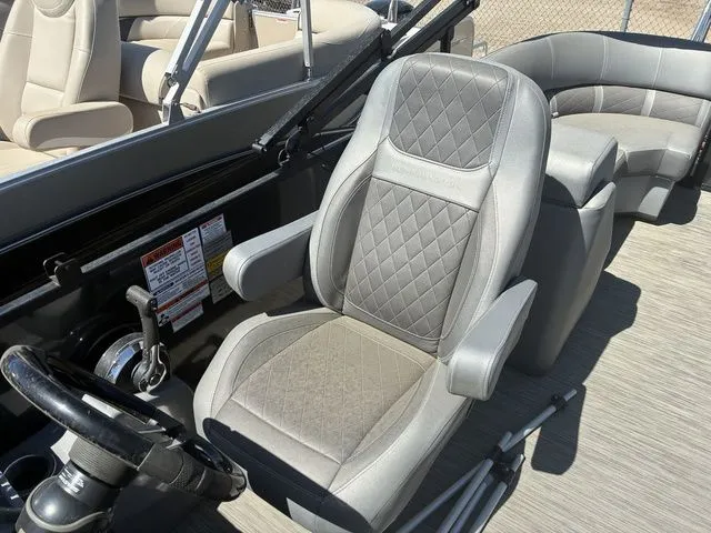 Slide: The Image of Interior of a 2022 Bennington 23LSR SPS with gray leather seats. - 19