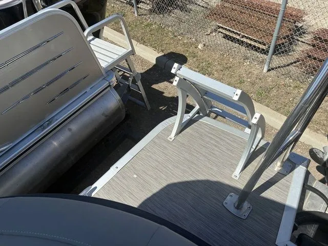 Slide: The Image of 2022 Bennington 23LSR SPS pontoon boat rear view with seating area. - 23