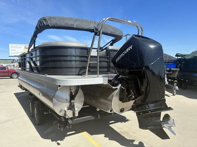 Slide: The Image of 2022 Bennington 23LSR SPS pontoon boat with Mercury outboard motor. - 8