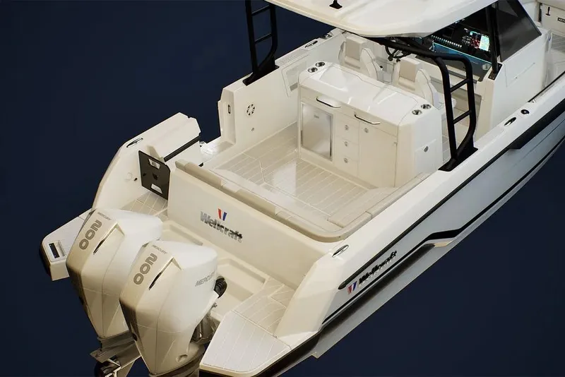 Slide: The Image of 2026 Wellcraft 28 T-Top boat with dual outboard engines, sleek design, and spacious deck. - 5